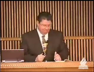 Dr. Mark Bailey standing at podium speaking at DTS Chapel