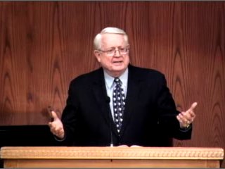 Dr. Chuck Swindoll standing at podium speaking at DTS Chapel