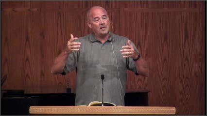 man standing at podium speaking at DTS Chapel