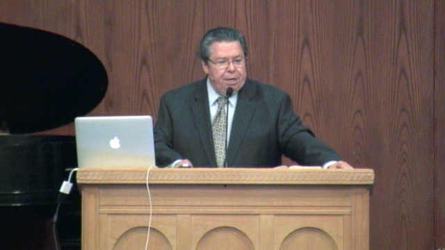 Dr. Mark Bailey standing at podium speaking at DTS Chapel