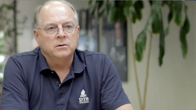 Tom Bradley seated while speaking