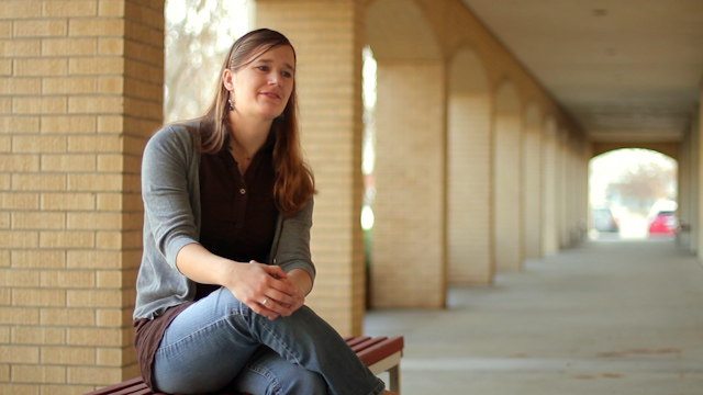 DTS alum Mary Jerkovic seated outside the DTS library