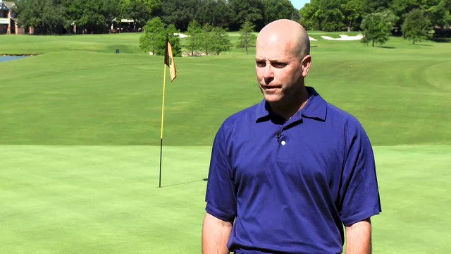 Brad Payne standing on a green on a golf course
