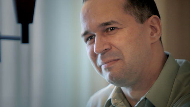 Dr. Cristian Barbosu smiling and looking at the camera