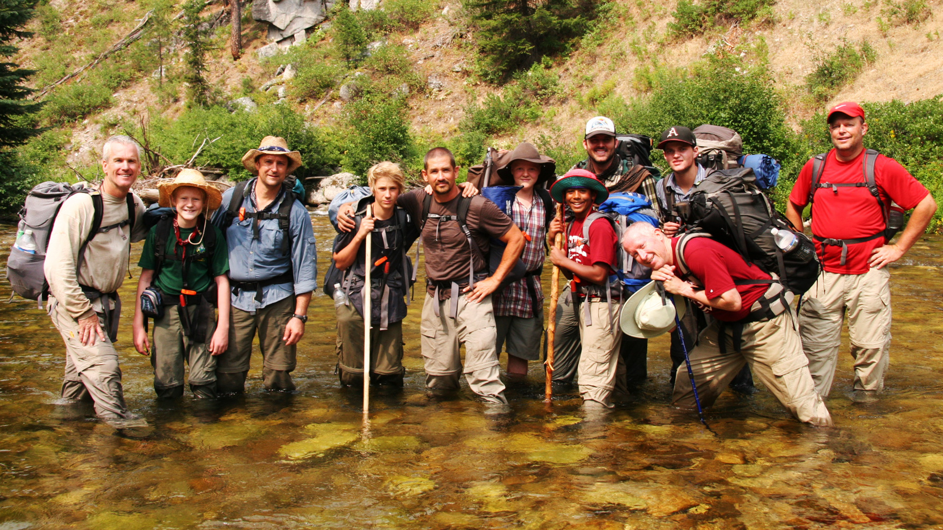 Will Gough with camping group standing in a riverbed
