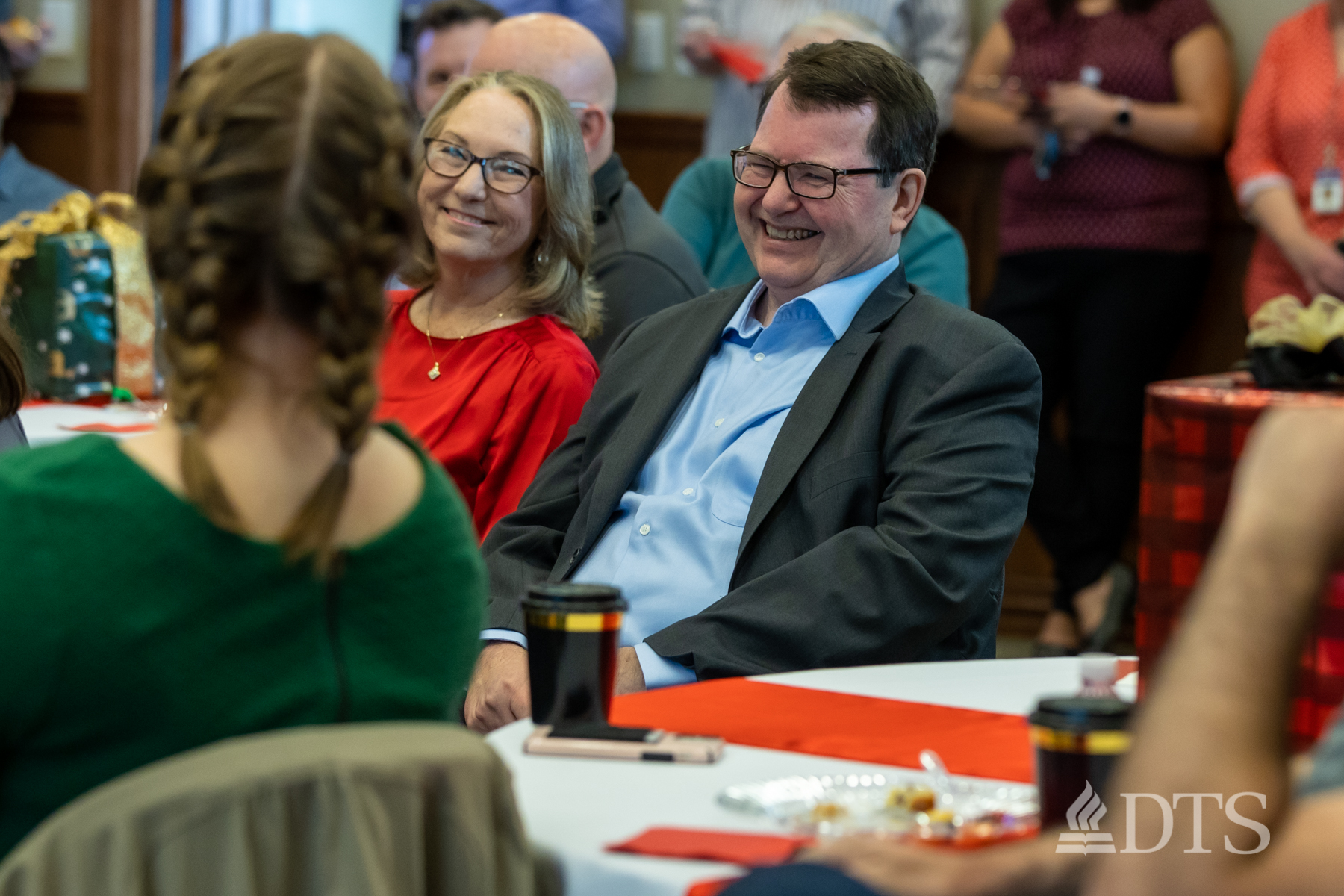 Dale Larson and wife smiling at the retirement reception