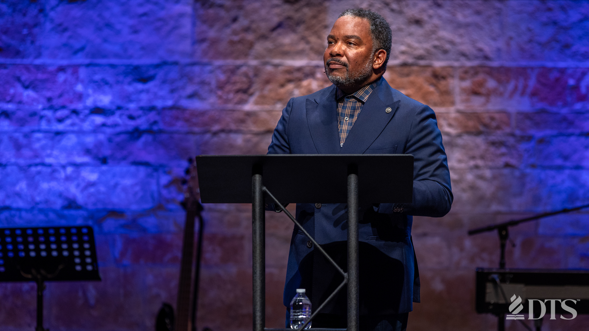 Stephen Brown preaching from the podium